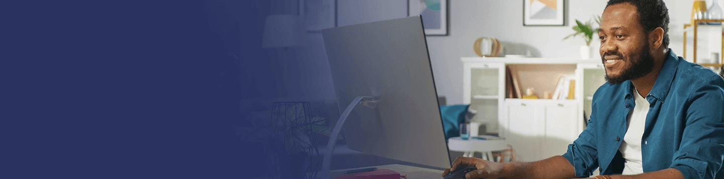 man sitting in front of the computer